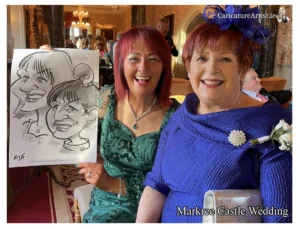 Alternative Wedding Entertainment Sligo Markree Hotel: photo of two women at a wedding reception laughing and holding their caricature by Allan Cavanagh