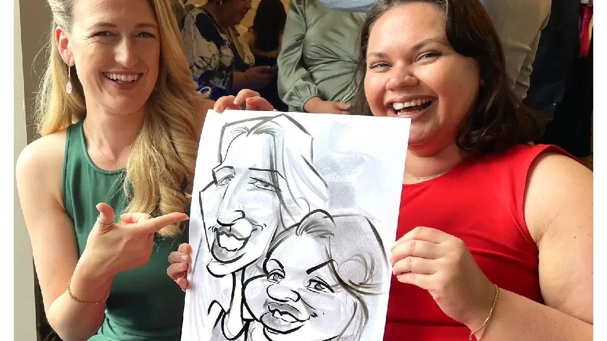 Vienna woods wedding entertainment packages two wedding guests laughing holding a caricature of themselves