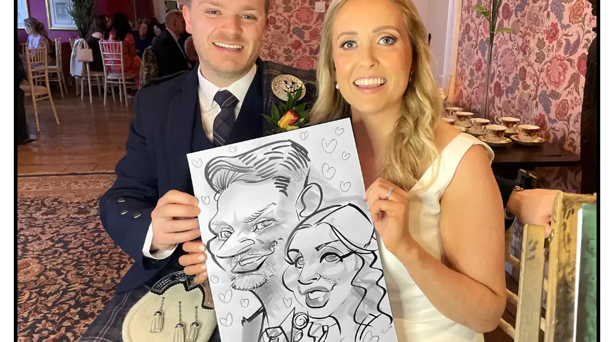 Newlywed Couple holding caricature by Allan Cavanagh in Ashley Park House Nenagh Wedding Photos Live Caricatures Allan Cavanagh Caricature Artist