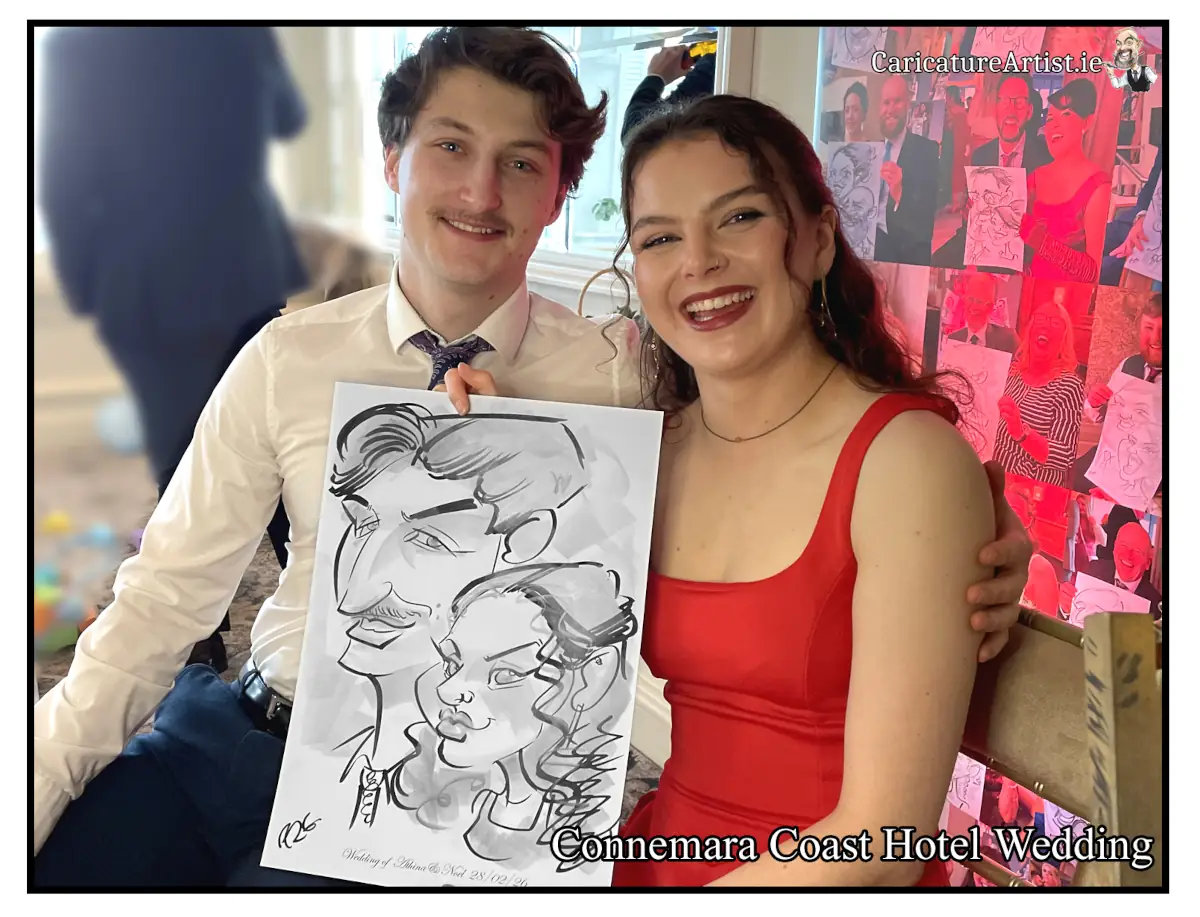 Couple at a wedding laughing and holding their caricature by Allan Cavanagh in Connemara Coast Hotel Wedding Entertainment Ideas Live Caricatures Allan Cavanagh