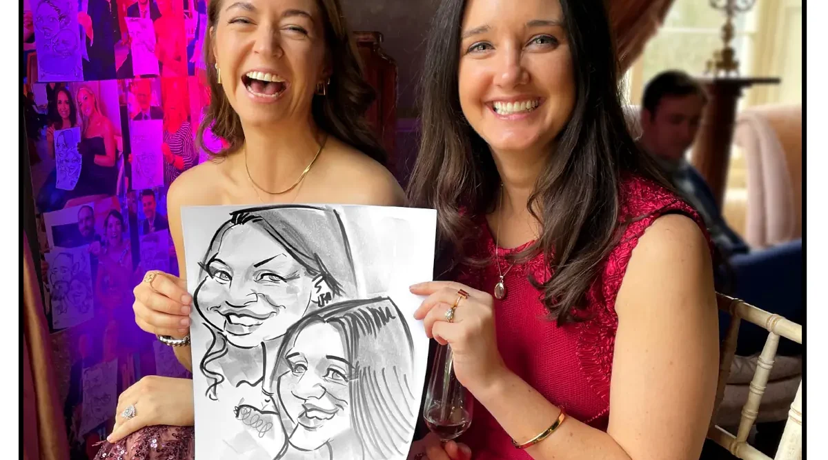 Tankardstown House Wedding Entertainment Live Caricatures by Allan Cavanagh two women laughing holding a caricature drawing by Caricaturist Allan Cavanagh