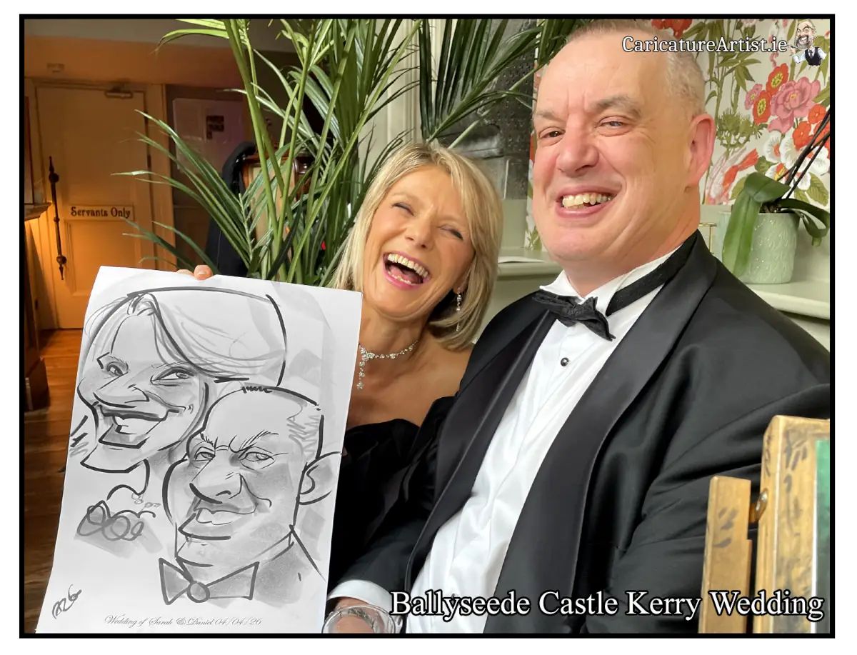 Photo of a laughing woman and man at a wedding holding a caricature of themselves by Allan Cavanagh. Ballyseede Castle Hotel Tralee Kerry Wedding Entertainment Ideas