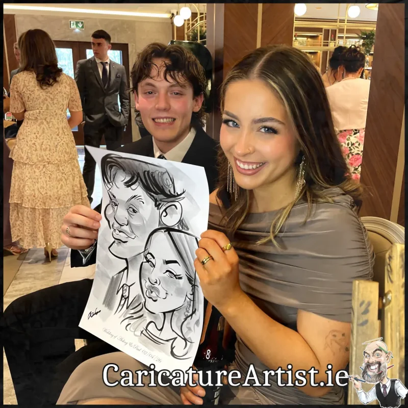 Johnstown Estate Wedding Entertainment wedding guests laughing holding Allan Cavanagh Caricatures (10) Copy