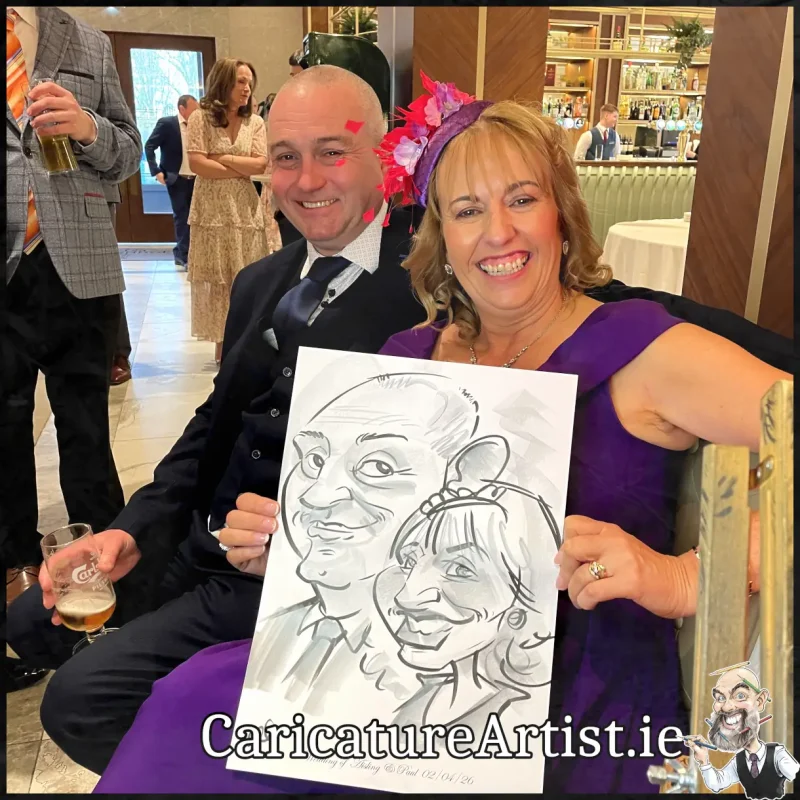 Johnstown Estate Wedding Entertainment wedding guests laughing holding Allan Cavanagh Caricatures (11) Copy