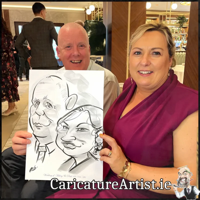 Johnstown Estate Wedding Entertainment wedding guests laughing holding Allan Cavanagh Caricatures (14) Copy