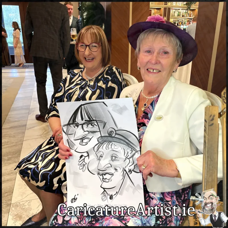 Johnstown Estate Wedding Entertainment wedding guests laughing holding Allan Cavanagh Caricatures (15) Copy