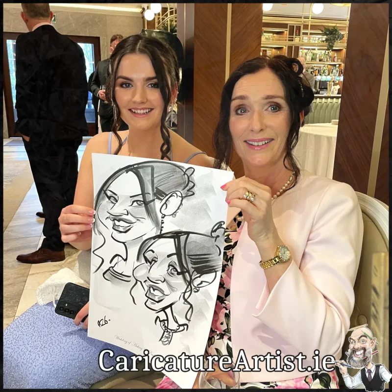 Johnstown Estate Wedding Entertainment wedding guests laughing holding Allan Cavanagh Caricatures (16) Copy