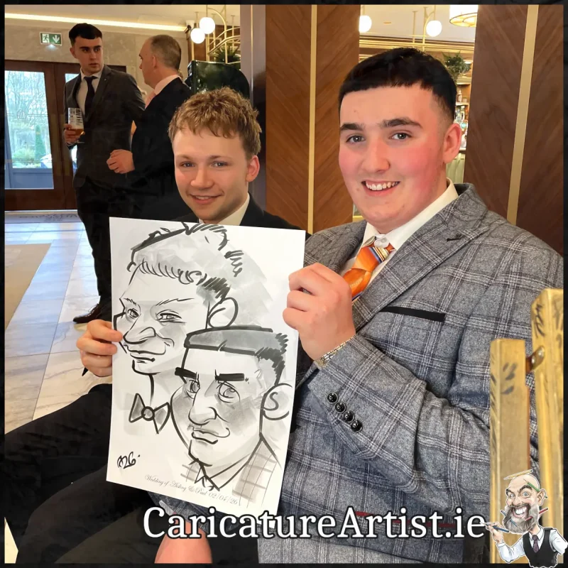 Johnstown Estate Wedding Entertainment wedding guests laughing holding Allan Cavanagh Caricatures (17) Copy