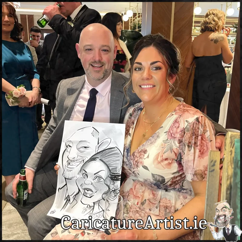 Johnstown Estate Wedding Entertainment wedding guests laughing holding Allan Cavanagh Caricatures (5) Copy