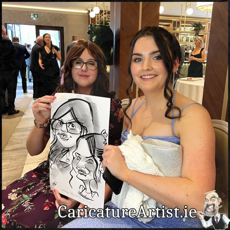 Johnstown Estate Wedding Entertainment wedding guests laughing holding Allan Cavanagh Caricatures (6) Copy