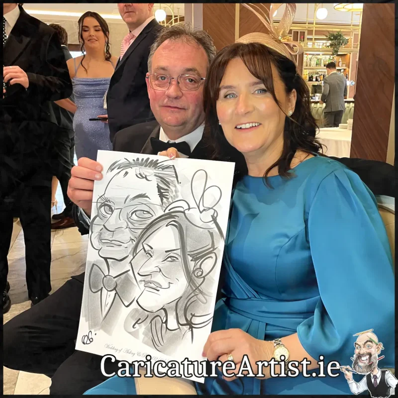 Johnstown Estate Wedding Entertainment wedding guests laughing holding Allan Cavanagh Caricatures (8) Copy