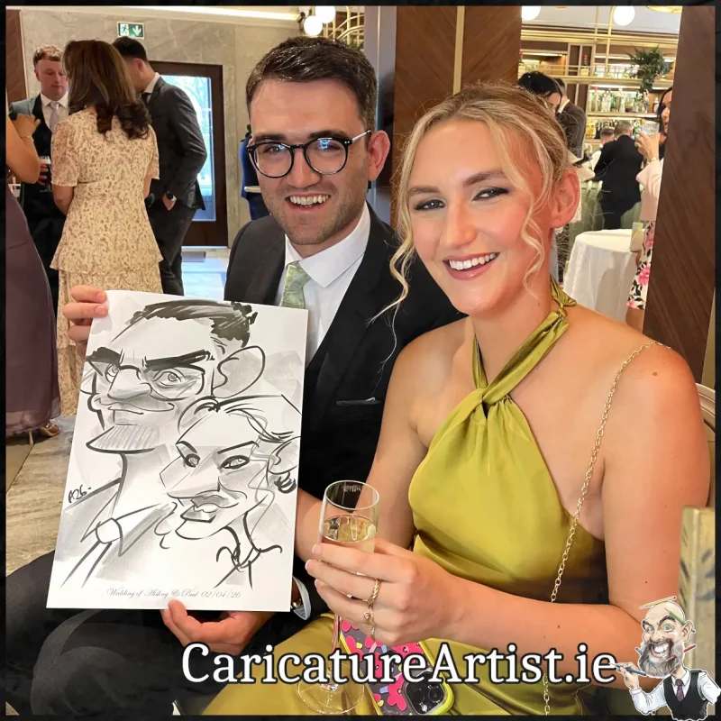 Johnstown Estate Wedding Entertainment wedding guests laughing holding Allan Cavanagh Caricatures (9) Copy