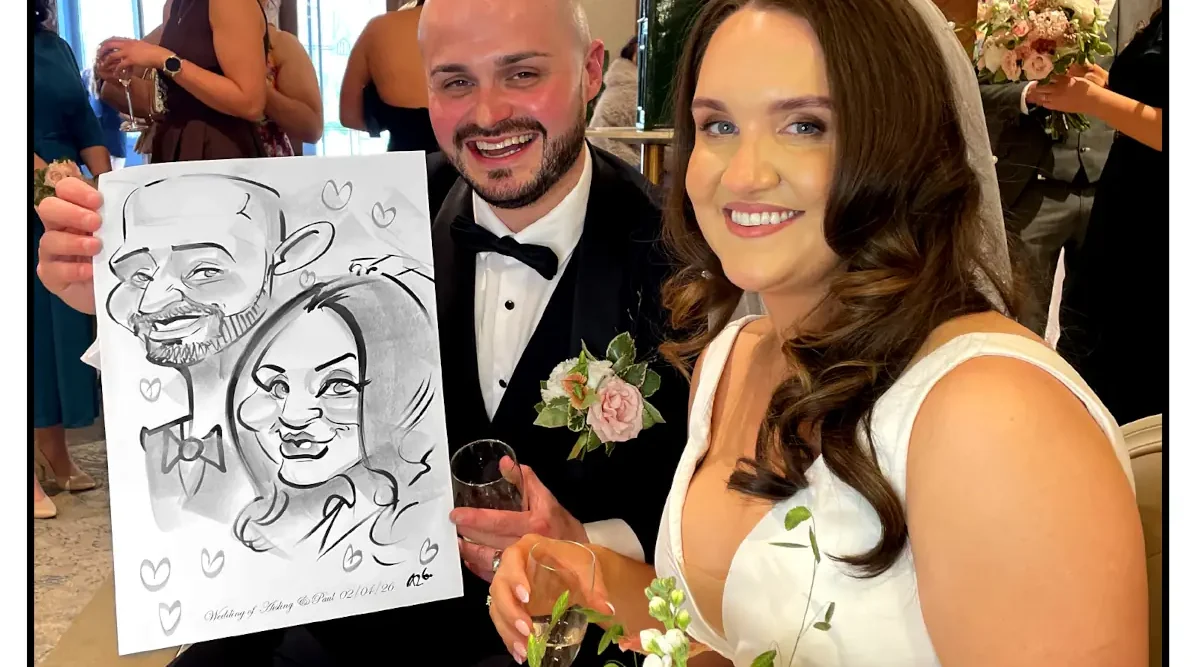 Johnstown Estate Wedding Entertainment wedding guests laughing holding Allan Cavanagh Caricatures featured image