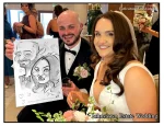 Johnstown Estate Wedding Entertainment wedding guests laughing holding Allan Cavanagh Caricatures featured image