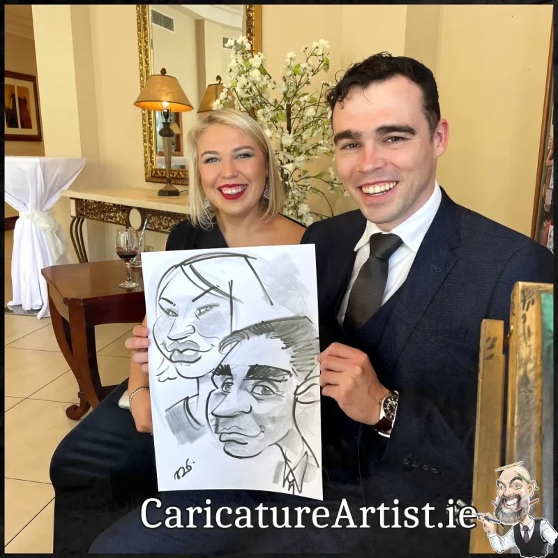 Mount Wolseley Wedding Entertainment 2 wedding guests laughing holding caricatures by Allan Cavanagh (1)
