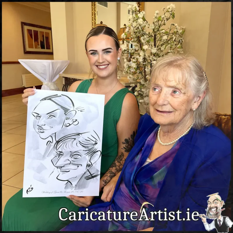 Mount Wolseley Wedding Entertainment 2 wedding guests laughing holding caricatures by Allan Cavanagh (13)