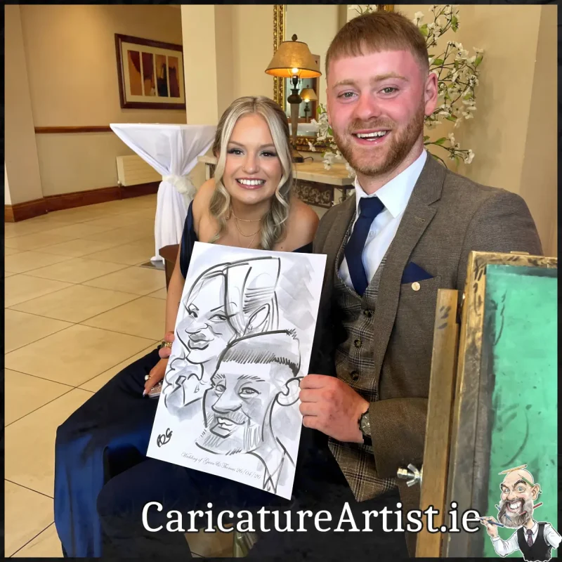 Mount Wolseley Wedding Entertainment 2 wedding guests laughing holding caricatures by Allan Cavanagh (15)