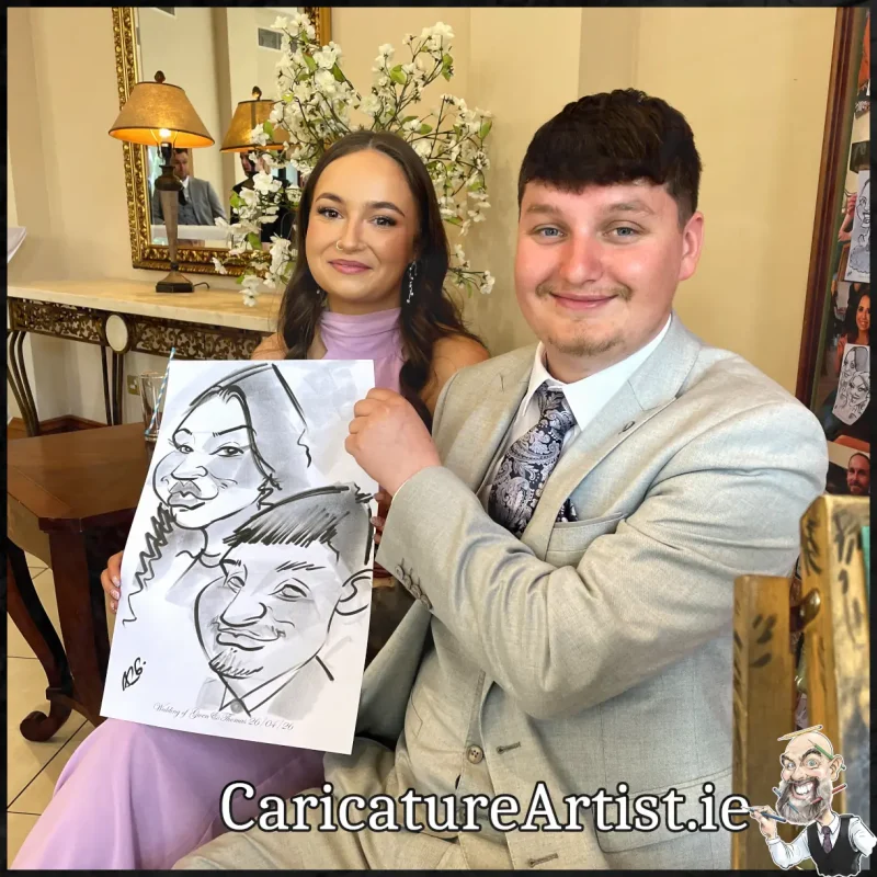 Mount Wolseley Wedding Entertainment 2 wedding guests laughing holding caricatures by Allan Cavanagh (16)
