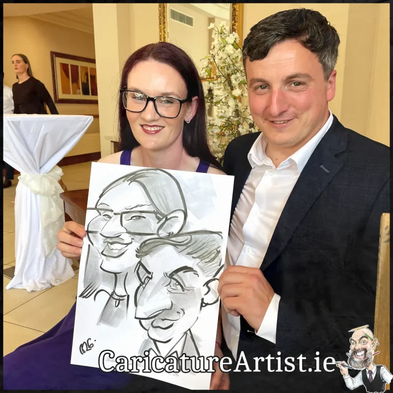 Mount Wolseley Wedding Entertainment 2 wedding guests laughing holding caricatures by Allan Cavanagh (3)