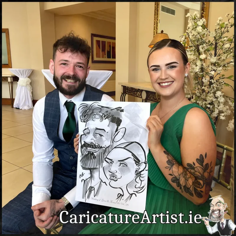 Mount Wolseley Wedding Entertainment 2 wedding guests laughing holding caricatures by Allan Cavanagh (7)