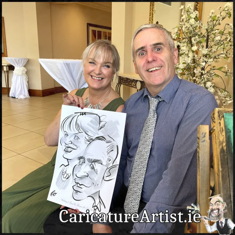 Mount Wolseley Wedding Entertainment 2 wedding guests laughing holding caricatures by Allan Cavanagh (8)