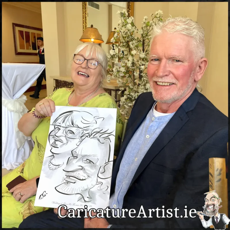 Mount Wolseley Wedding Entertainment 2 wedding guests laughing holding caricatures by Allan Cavanagh (9)