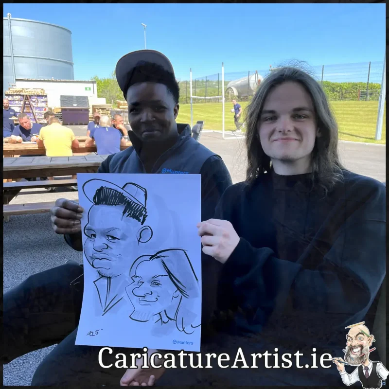 Staff Summer Party Entertainment Ireland Caricatures by Allan Cavanagh Cork Photo of 2 people holding caricature drawing of themselves(16)