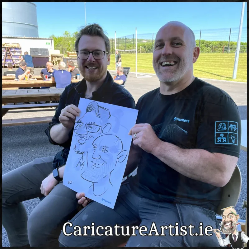 Staff Summer Party Entertainment Ireland Caricatures by Allan Cavanagh Cork Photo of 2 people holding caricature drawing of themselves(17)
