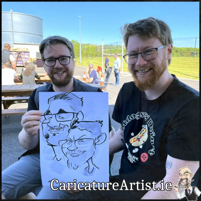 Staff Summer Party Entertainment Ireland Caricatures by Allan Cavanagh Cork Photo of 2 people holding caricature drawing of themselves(18)