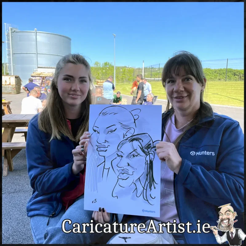 Staff Summer Party Entertainment Ireland Caricatures by Allan Cavanagh Cork Photo of 2 people holding caricature drawing of themselves(19)