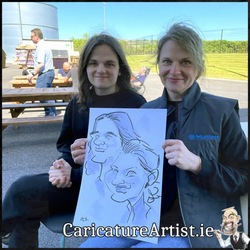 Staff Summer Party Entertainment Ireland Caricatures by Allan Cavanagh Cork Photo of 2 people holding caricature drawing of themselves(20)