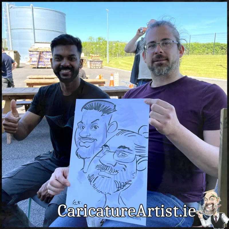 Staff Summer Party Entertainment Ireland Caricatures by Allan Cavanagh Cork Photo of 2 people holding caricature drawing of themselves(24)