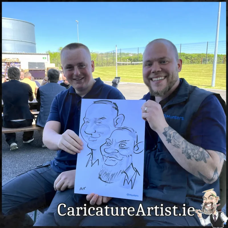 Staff Summer Party Entertainment Ireland Caricatures by Allan Cavanagh Cork Photo of 2 people holding caricature drawing of themselves(26)