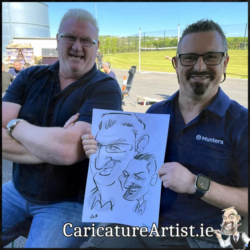 Staff Summer Party Entertainment Ireland Caricatures by Allan Cavanagh Cork Photo of 2 people holding caricature drawing of themselves(27)