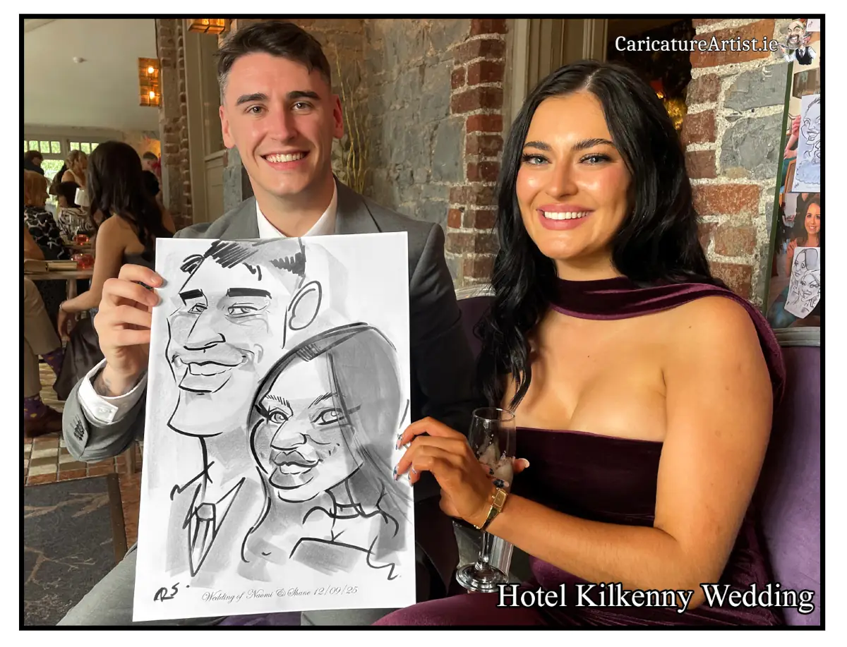 Hotel Kilkenny Wedding Entertainment Caricatures Irelands top rated caricature artist Allan Cavanagh photo of male and female wedding guests at a wedding holding a caricature of themselves by Allan Cavanagh